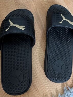 Puma Black Slide Sandals with Gold PUMA Logo
